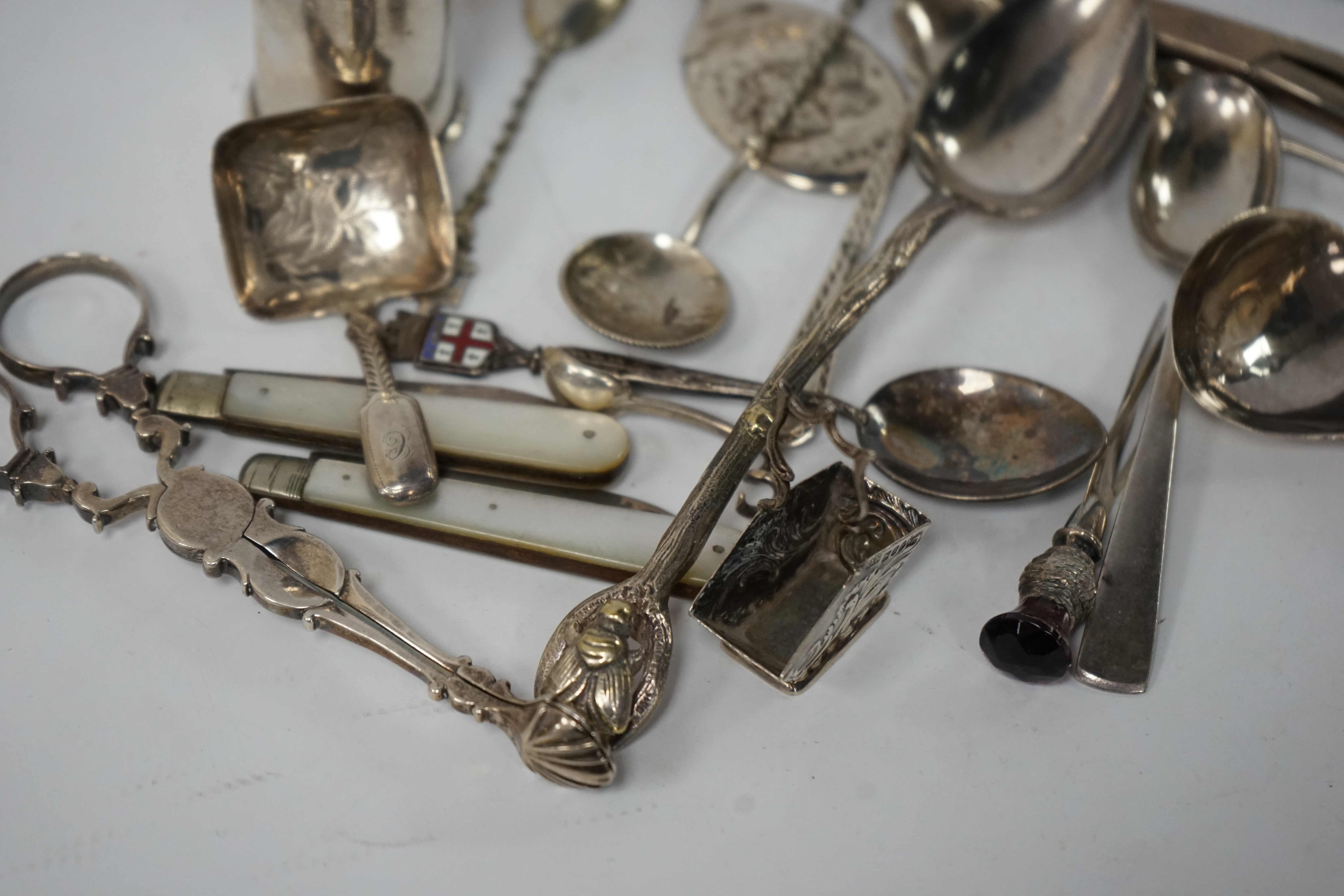 Assorted small silver and other white metal items including fruit knives, a pair of Georgian sugar nips, by Henry Plumpton, circa 1750, a pair of Victorian grape shears, Wakely & Wheeler, London 1887, pepperette, a Georg